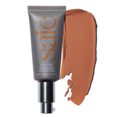 Saie Slip Tint SPF 35 bottle close-up with dewy finish