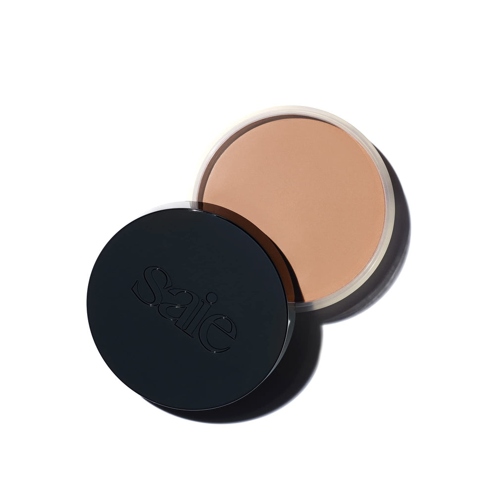 Saie Sun Melt bronzer compact close-up showing creamy texture for effortless blend.