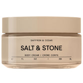Salt and Stone saffron-cedar bottle showcases a luxurious body cream with lasting hydration.
