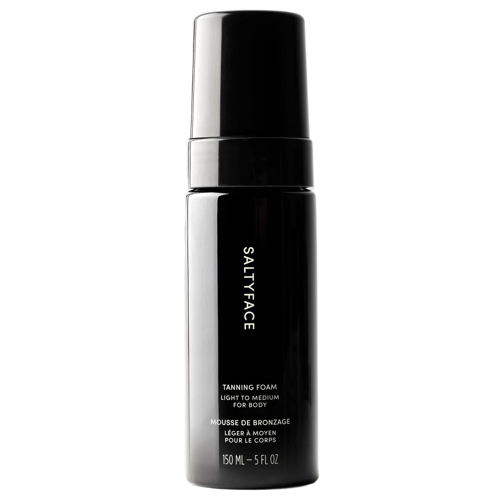SALTYFACE Tanning Foam bottle demonstrates easy, streak-free application for a sun-kissed glow.
