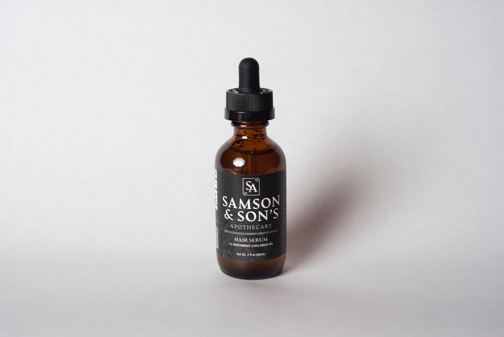 Samson & Son's Hair Regrowth Serum bottle closeup, premium packaging for daily use.