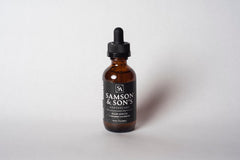 Samson & Son's Hair Regrowth Serum bottle closeup, premium packaging for daily use.