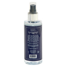 Close-up of the spray mist on a wrist emphasizing a long-lasting fragrance.