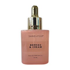 Sand + Fog Berries & Cream bottle with dropper showing precise application and lasting scent