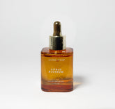 Sand + Fog Citrus Blossom bottle dropper for precise, personal fragrance application.