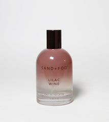 Sand + Fog Lilac Wine EDT bottle gradient highlights chic design for daily wear.