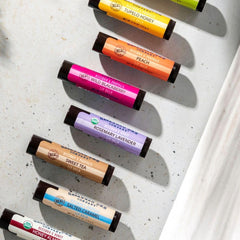 Application glide of Savannah Bee lip balm on lips.