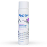 Seaweed Bath Co. Volumize bottle pour demonstrates thickening action with seaweed and barley for fine hair.