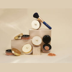 Senegence loose setting powder applied over foundation to set makeup and highlight.