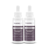Shapiro MD Minoxidil bottle on a clean surface for scalp hair growth support.