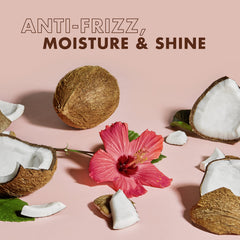 Applying Sheamoisture Coconut Hibiscus to damp hair for twists