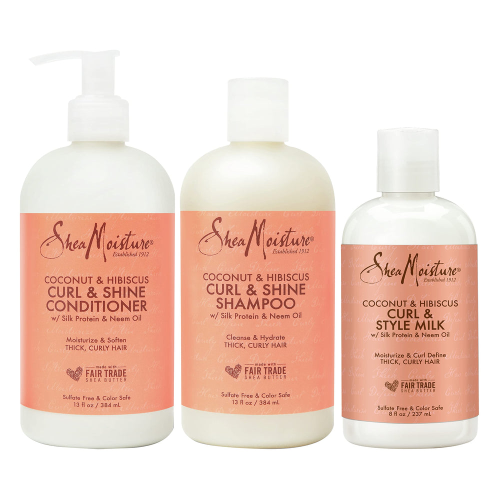 SheaMoisture Coconut Hibiscus Shampoo bottle demonstrates hydrated, bouncy curls.