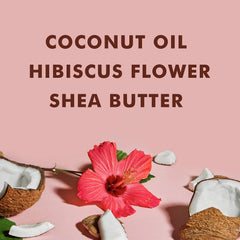 SheaMoisture Coconut Hibiscus Shampoo lather shown on hair, sulfate-free formula.