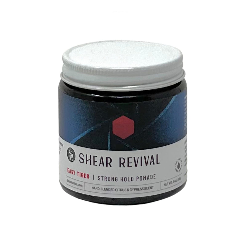 Shear Revival Easy Tiger pomade jar top view highlighting strong hold for short to medium hair.