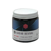 Shear Revival Easy Tiger pomade jar top view highlighting strong hold for short to medium hair.