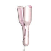 SHEGLAM Cupid's Charm 1-inch waver ready for soft, beachy waves.