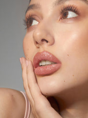 Close-up of glitter shards delivering eye-catching sparkle on lips.