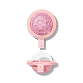 SHEGLAM Lunar Glow Highlighter on heart-galaxy pattern for radiant facial glow.