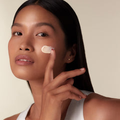 Pearl-sized amount of Shiseido Benefiance Wrinkle Smoothing Day Cream applied to face