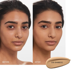 Shiseido Synchro Skin foundation pump being pressed for precise, even application.