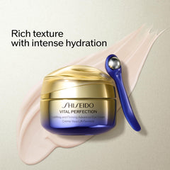 Shiseido Vital Perfection eye cream being gently massaged around the eye.