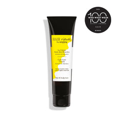Applying Curl Care Cream on damp hair helps define curls.