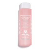 Sisley Paris Floral Toning Lotion bottle pouring onto skin for gentle cleansing.