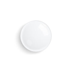 Sisley Paris Floral Toning Lotion on a cotton pad for makeup removal and toning.