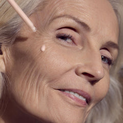 Sisley Paris serum on neck area aiming for firmer, smoother contours.