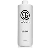 SJOLIE Sunless pH Balancing Spray bottle emitting a fine mist for skin prep.