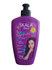 SKALA Expert Curl Cream bottle showing the 2-in-1 leave-in formula for hydrated, frizz-controlled curls.