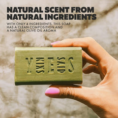 Skin Said Yes soap bar in hand demonstrating easy cleansing on the go.