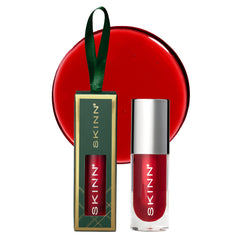 SKINN Luminous Lip Oil Crimson bottle swirl delivers silky shine and hydration.