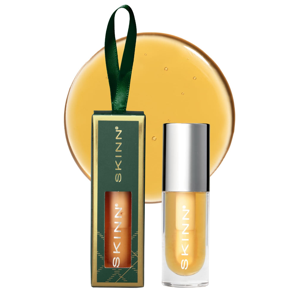 SKINN Luminous Lip Oil Golden bottle ready to hydrate and glow