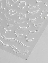 SOFTSOUL rhinestones and pearls nail stickers embossed sheet for a luxe salon look.