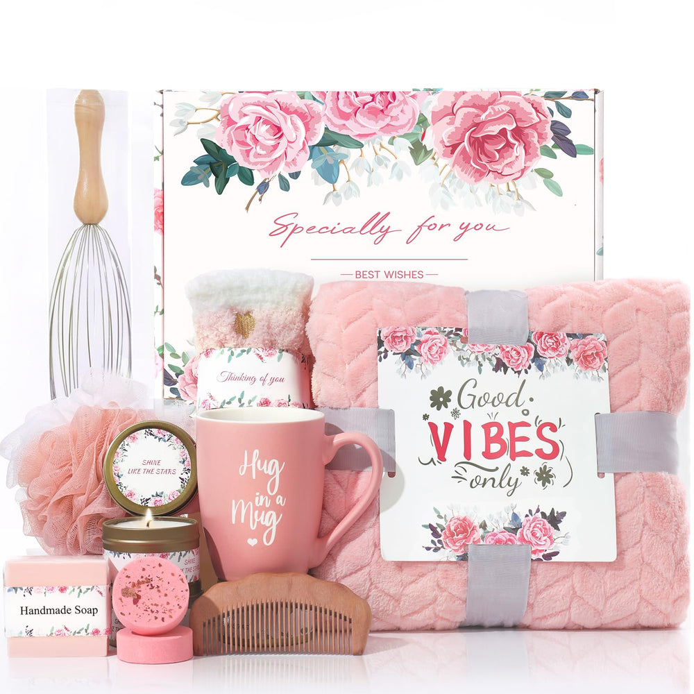 Solemon pink gift basket with plush blanket and spa items for relaxation.