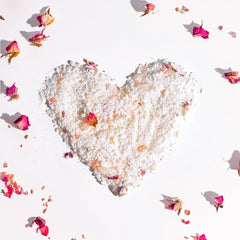 SPICE BEAUTY Goat Milk & Rose soak rose petals close-up suggesting nourishing hydration.