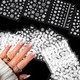 SPLOCUDU snowflake nail stickers for a shimmering holiday manicure.
