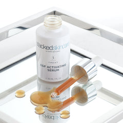 StackedSkincare Hydrating EGF Serum pump closeup shows quick absorption.