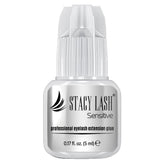 STACY LASH Sensitive glue bottle close-up showing low fumes and professional use