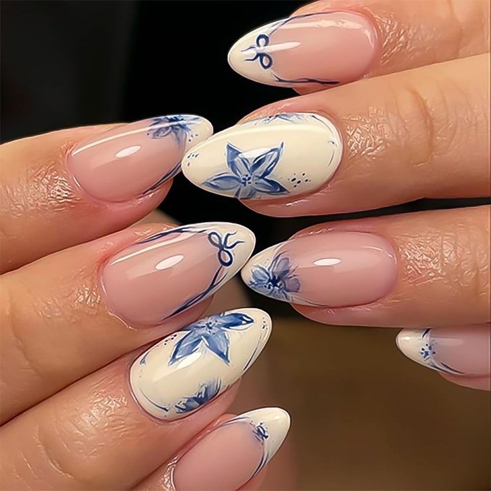 Stbisen almond nude nails with blue floral petals for versatile daily wear.