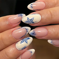 Stbisen almond nude nails with blue floral petals for versatile daily wear.