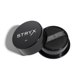 Stryx Anti-Shine Powder compact with built-in sponge for quick touch-ups.
