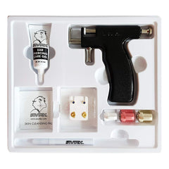 Studex ear-piercing gun kit with marker gel for precise placement during at-home piercings.