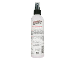 Close-up of pump dispense on Suavecita styling spray for precise application.
