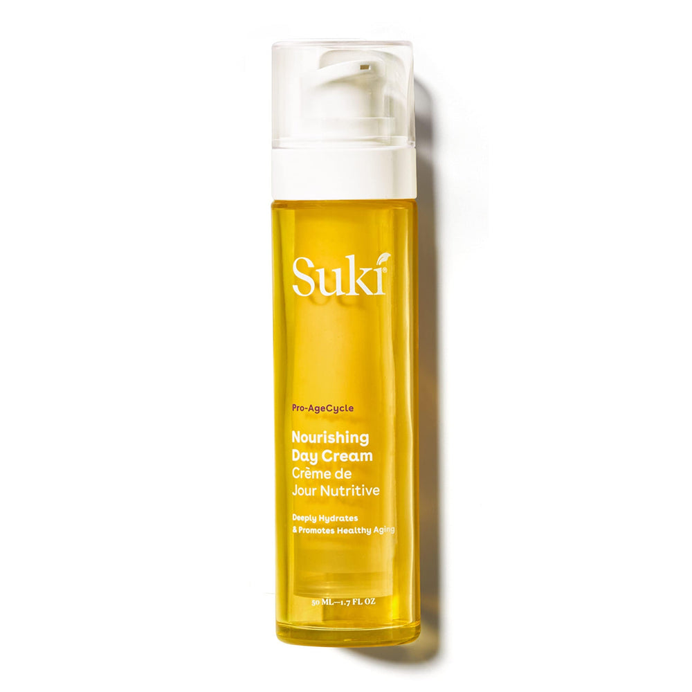 Suki Nourishing Day Cream bottle pour highlights hydration and Vitamin C benefits.