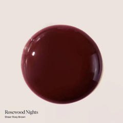 Dream Lip Oil Tube close-up showing a shiny rosewood tint with non-sticky hydration