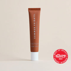 Summer Fridays tinted lip balm on lips delivers natural shine and moisture.