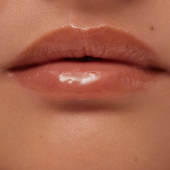 Lips wearing Summer Fridays Hot Cocoa lip balm showing smooth shine.