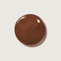 Swatch of Summer Fridays Hot Cocoa lip balm showing sheer chocolate tint.